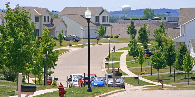 Holophane's LED post-top lights line the streets of a residential neighborhood.