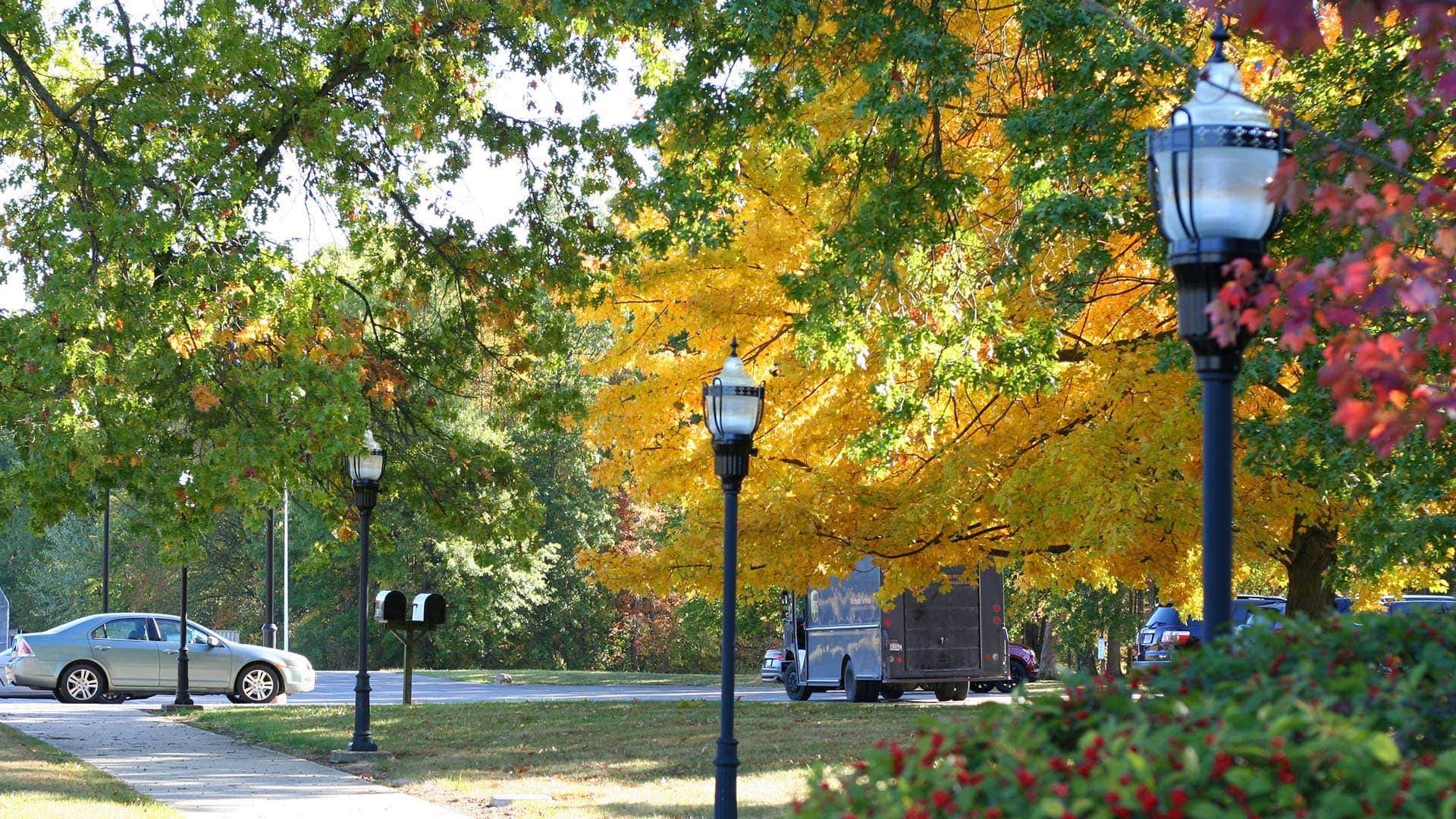 Walkways are beautiful by day and visually comfortable by night with GranVille acorn lights from Holophane.