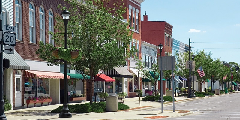 Downtown streets decorated with post-top LED lantern lights from Holophane.