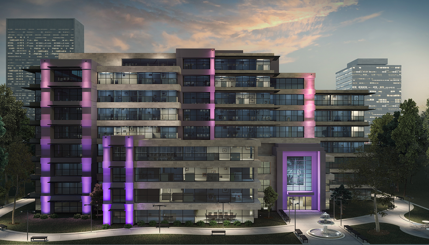 Full front view of office building, showing the use of architectural floodlights on the façade with accent lighting.
