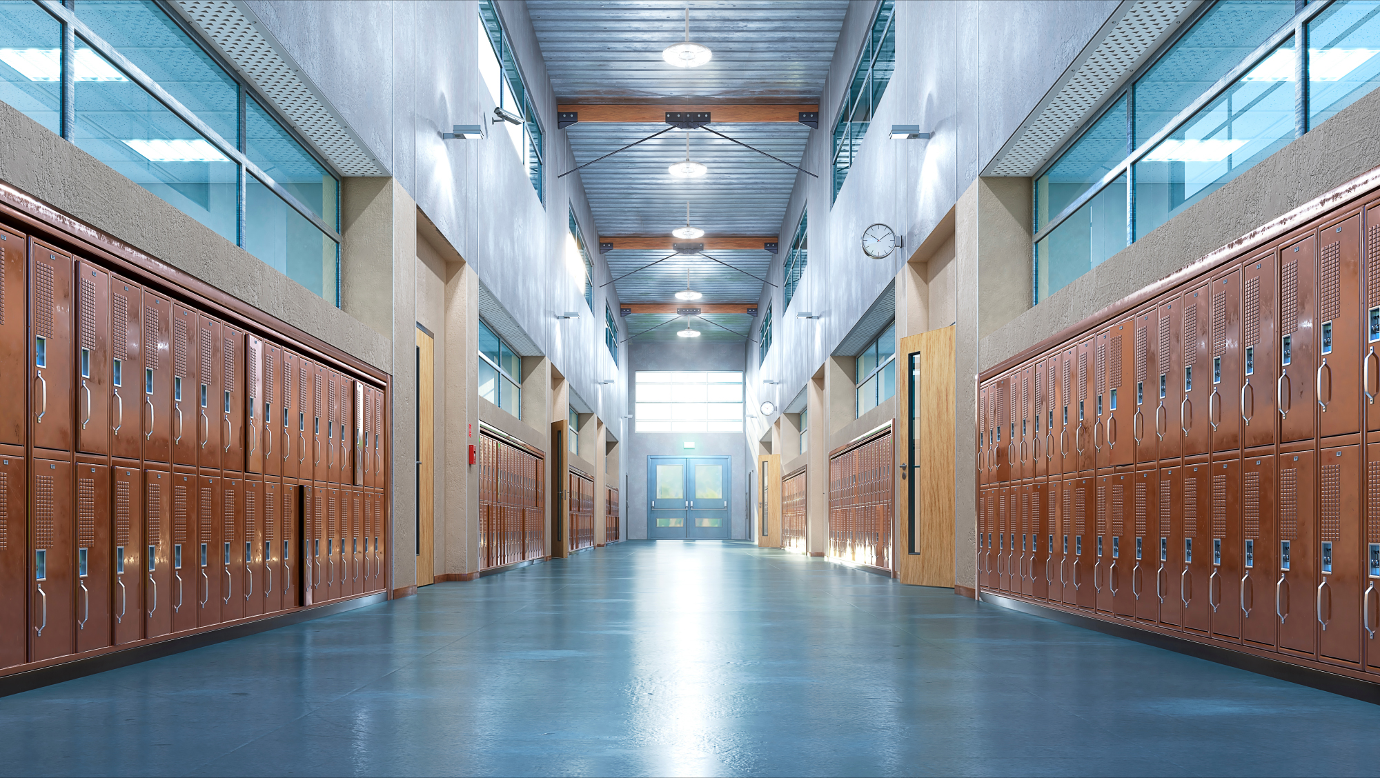 Compact Pro™ LED Round High Bay fixtures from Lithonia Lighting illuminate a high school hallway.