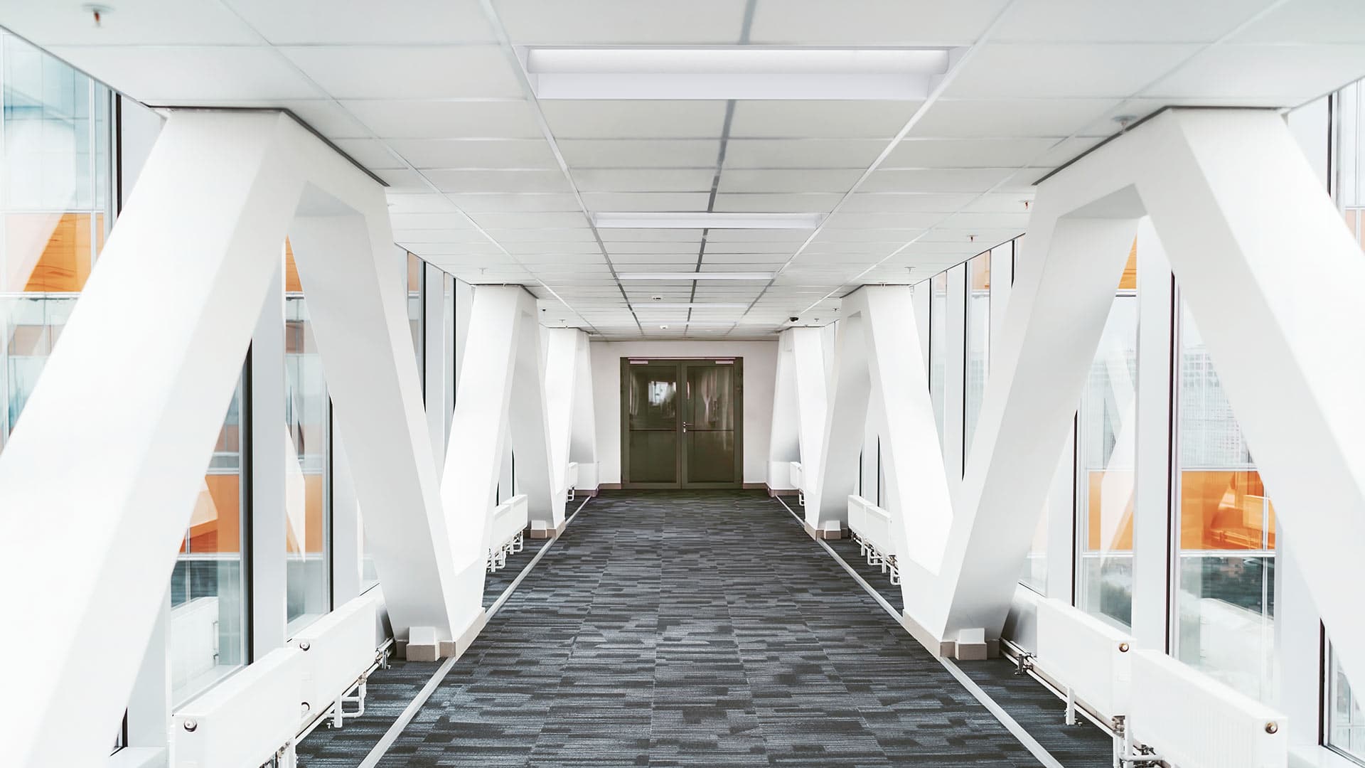 Lithonia's STACK LED lay-in lights light the path of a hallway