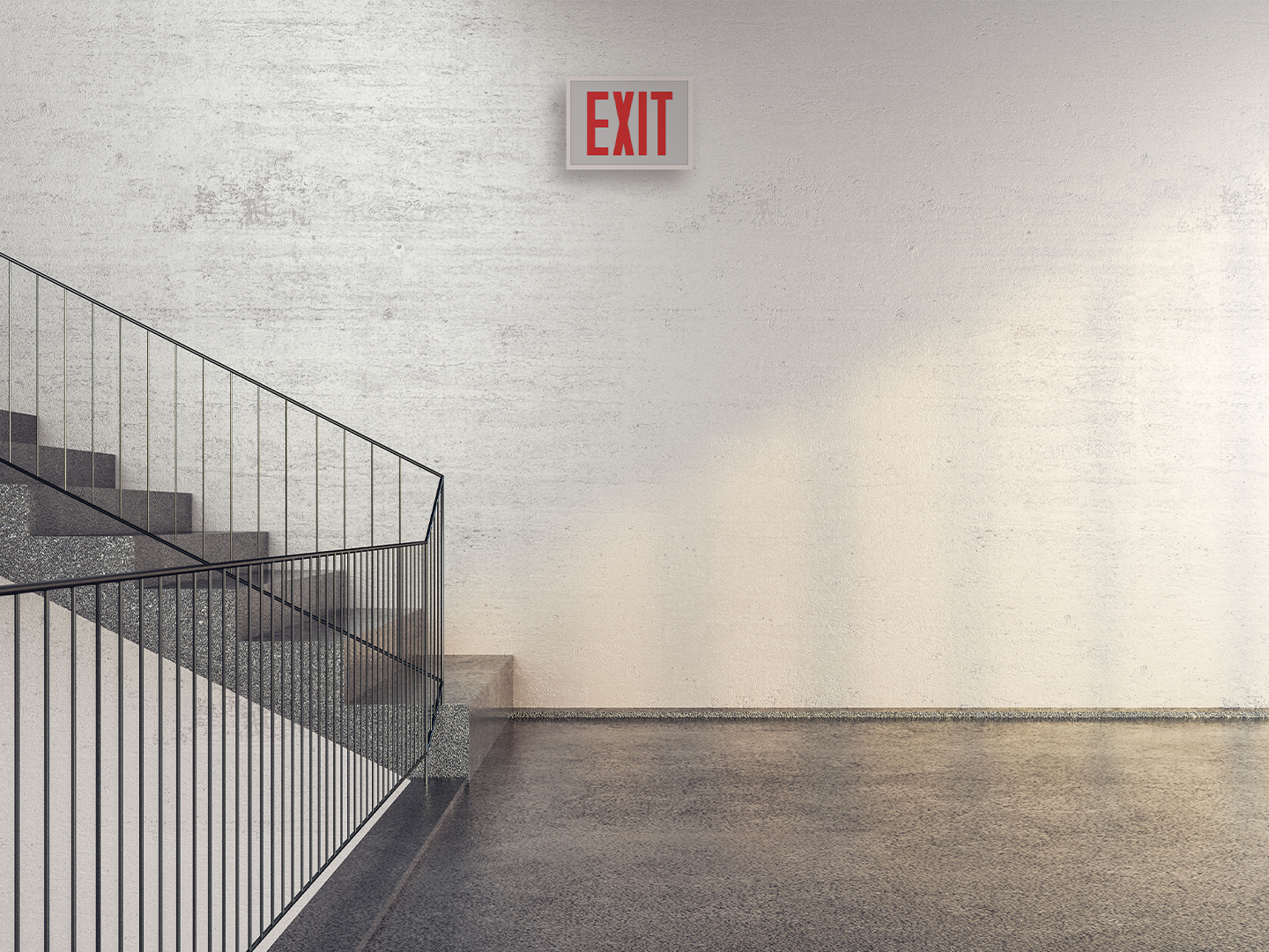 A Lithonia Titan Steel exit sign is shown mounted to the wall in a stairwell.